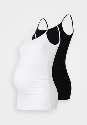 Duas camisetas de maternidade em branco e preto. Ambas apresentam alças ajustáveis, um design justo e laterais franzidas para maior conforto.