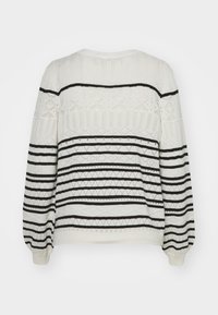 Knit sweater in white with black horizontal stripes. Features various textured patterns and balloon sleeves. Round neck and loose fit.