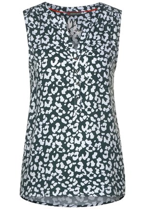 Ärmellose schwarze Bluse mit weißem unregelmäßigen Fleckenmuster, V-Ausschnitt mit Knopfleiste und einer Brusttasche auf der linken Seite.