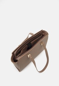 Brown synthetic tote bag with dual handles, a rectangular shape, exterior zip pocket, and gold-tone hardware accents. Interior features a soft lining.