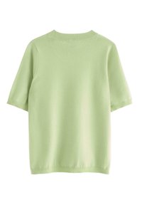 Maglione verde chiaro a maniche corte con scollatura rotonda, texture liscia e bordi a coste. Design minimalista senza motivi o dettagli.