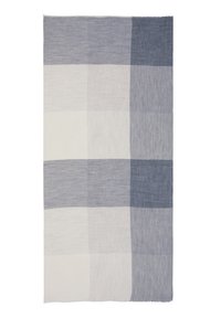 Coperta in cotone con un design a quadri in tonalità alternate di blu e bianco, rifinita con bordi sfrangiati per un tocco di texture.
