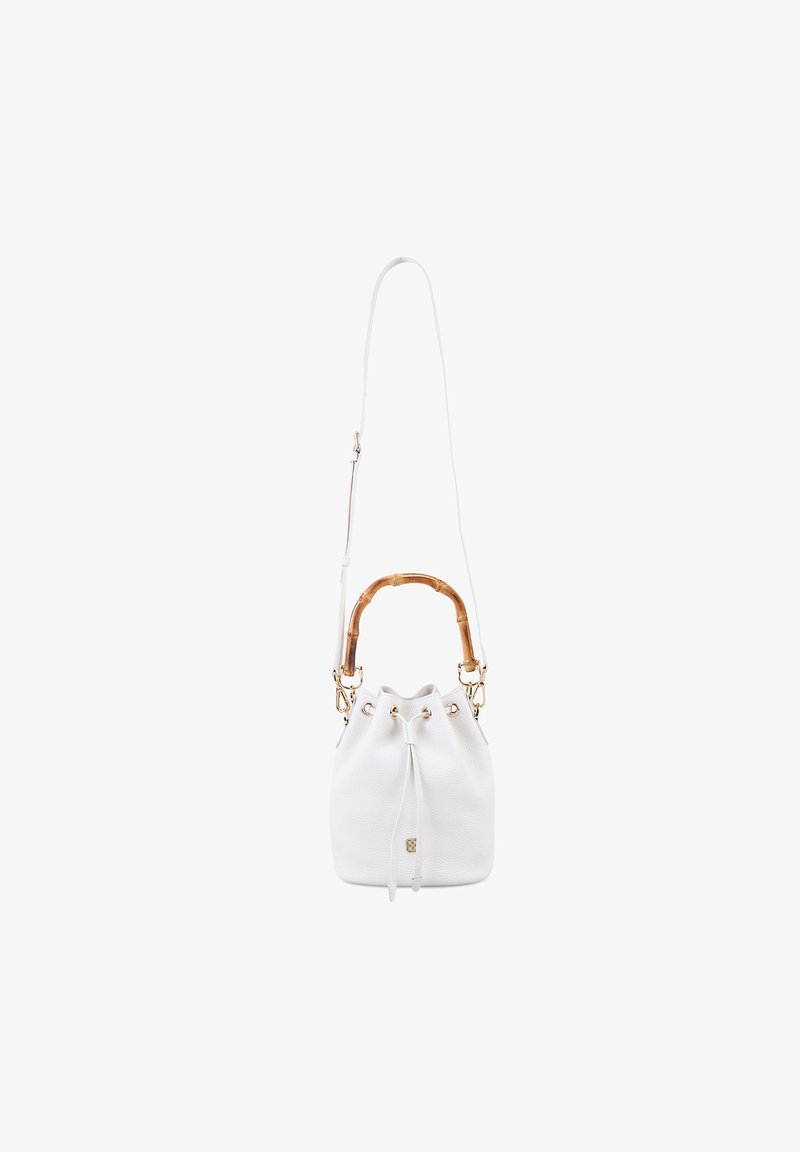 White leather bucket bag with a bamboo handle, adjustable shoulder strap, and gold hardware accents. Drawstring closure at the top.