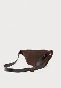 Brown suede waist bag with adjustable glossy black leather strap and gold circular buckle on white background.