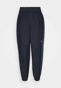 Dark blue denim jogger pants with elastic waistband and cuffs, featuring light blue side stripes and Adidas trefoil logo on the left leg.