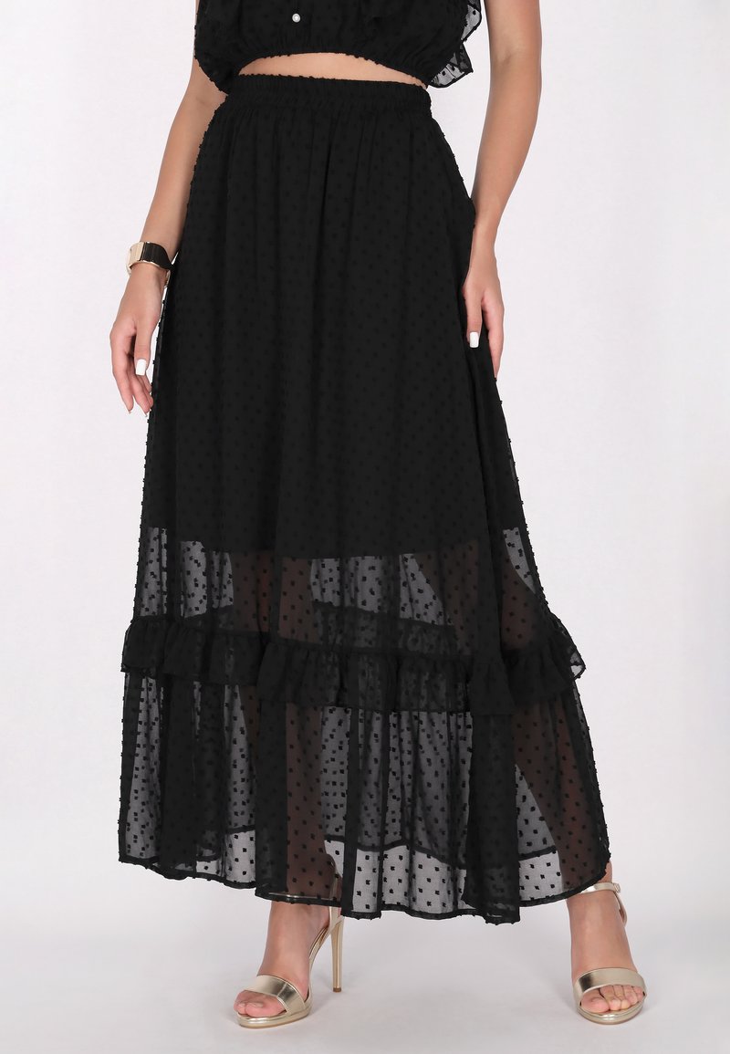 Schwarzer Maxi-Rock mit Punkten und einem Rüschensaum, aus durchsichtiger Stoff gefertigt, mit einem enganliegenden elastischen Bund und geschichtetem Design.