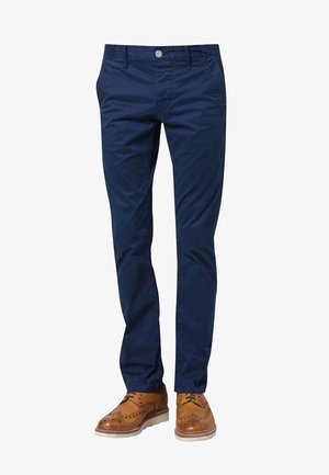 Tmavě modré bavlněné chino kalhoty s úzkým střihem, vybavené zipem a předními kapsami. Doplňují je stříbrný knoflík a jemné šití.