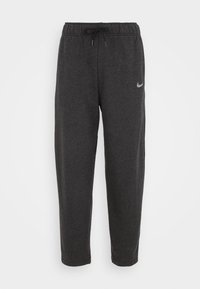 Šedé tepláky s elastickým pasem, šňůrkou a logem Nike na přední straně. Vyrobené z měkké, texturované látky. Rovný střih nohavic.