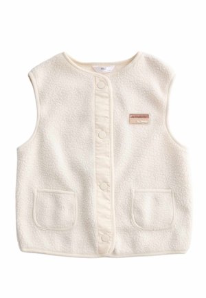 Flødefarvet ærmeløs fleecervest med trykknapper, to forlommer og et lille rektangulært 'Authentic by Design'-mærke på brystet.