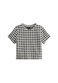 Crop top noir et blanc à carreaux avec des manches courtes. Fait d'un matériau texturé, il présente un col rond et une coupe boxy.