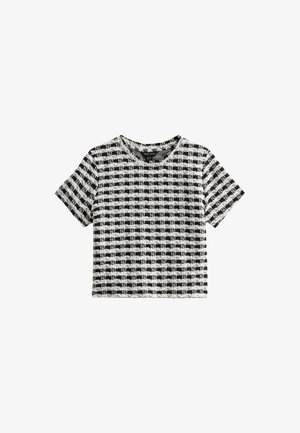 Schwarz-weißer karierter Crop-Top mit kurzen Ärmeln. Hergestellt aus strukturiertem Material, mit einem runden Ausschnitt und einer kastigen Passform.