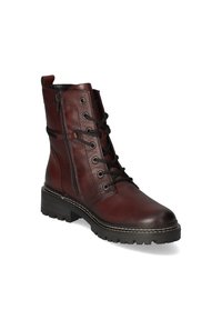 Bottines en cuir marron avec un laçage à l'avant, fermeture éclair sur le côté, bout rond, talon épais et semelle en caoutchouc texturé. Détails surpiqués autour de la semelle.