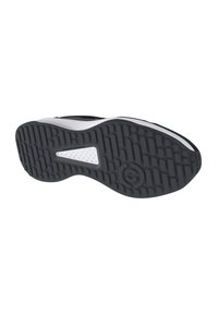 Suela de zapatilla deportiva en blanco y negro con patrón de tracción de goma texturizada y logo. Forma curva con laterales reforzados para mayor durabilidad.