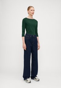 ONLY Tall ONLJUICY WIDE RINSE  - Wide leg - dark blue denim