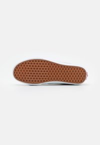 Rubber outsole with a textured pattern; white midsole; smooth upper edge; overall rectangular shape with rounded toe and heel edges.