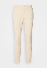 Beige katoenen broek met slim fit, voorzien van een knoopsluiting, ceintuurlussen en zijzakken. Glad textuur en eenvoudig ontwerp.
