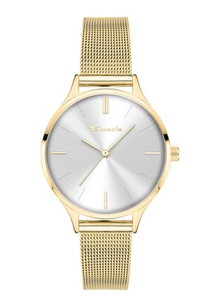 Guldtonet armbåndsur med sølv solstrålediagram, minimale timeindikatorer, tre visere og guld netrem, mærket "Tamaris" synligt på urskiven.