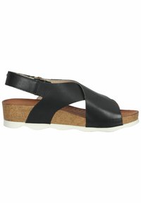 Sandaleta de cuero negro tipo slingback con suela de corcho, que presenta un diseño de tiras cruzadas y plantilla texturizada, realzada por una suela blanca.
