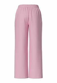 Pantalons larges roses en matériau doux. Dotés d'une taille élastique et d'une texture lisse sans motifs ni accents visibles.