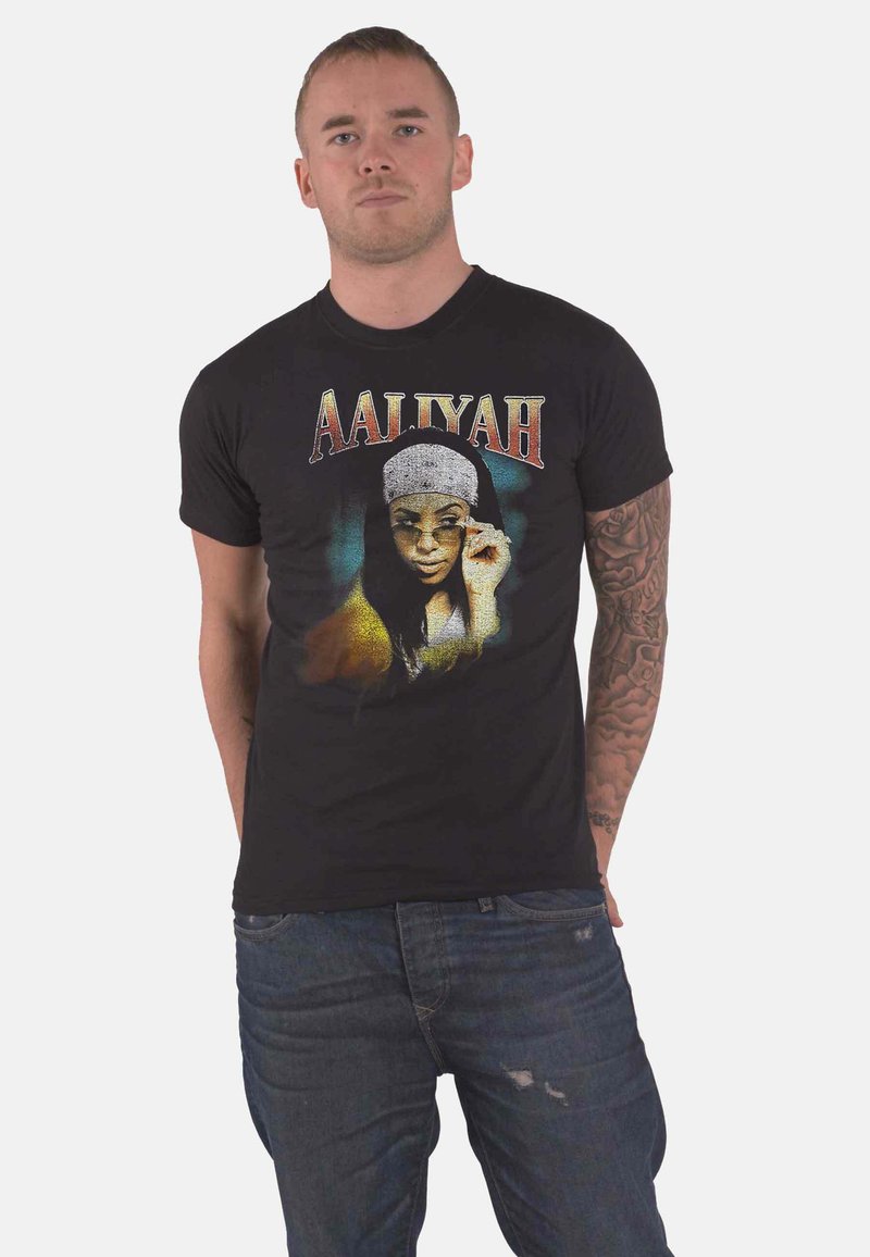 Black cotton t-shirt featuring a graphic portrait of Aaliyah with a colorful design and the name "AALIYAH" in bold, stylized lettering.