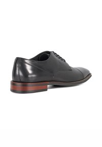 Black leather dress shoe with a smooth finish, a rounded toe, textured side panels, and a contrasting brown layered heel.