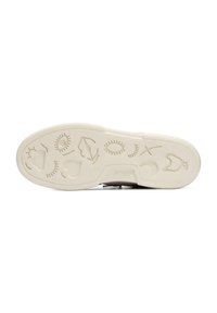 La semelle de chaussure en caoutchouc beige présente des imprints ludiques d'yeux, de cœurs, de feuilles et de visages souriants, avec un motif texturé pour l'adhérence.