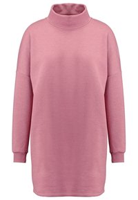 Pull rose à col roulé à manches longues avec poignets côtelés et coutures d'épaule tombantes, en tissu maille douce.