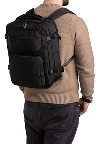 Black backpack with multiple pockets, adjustable straps, and robust zippers, featuring a sleek rectangular design and durable fabric.