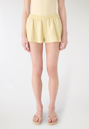 SVASATI A UNITA - Pantaloni sportivi - giallo chiaro