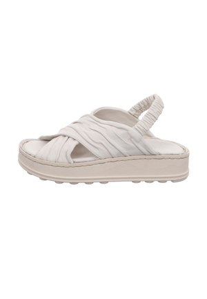 White sandal featuring a soft, textured upper with pleated straps, a cushioned footbed, and a thick, light-colored rubber sole.