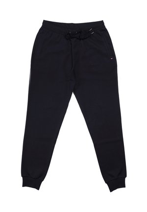 Donkerblauwe trainingsbroek gemaakt van zachte stof, voorzien van een elastische tailleband met trekkoord, zijzakken en geribbelde boorden bij de enkels.