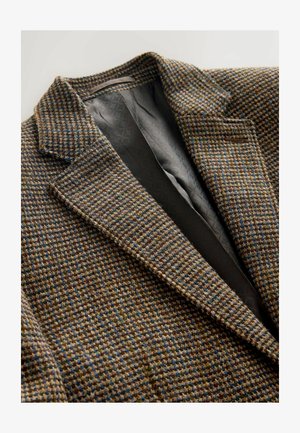 Texturiertes braunes und blaues Hahnentritt-Blazer mit Reverskragen und schwarzer Steppinnenfutter. Besitzt strukturierte Schultern und eine taillierte Passform.