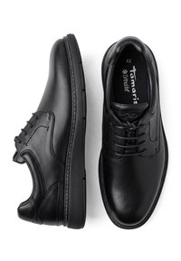 Chaussures à lacets pour homme en cuir noir, une vue de côté et l’autre de dessus, taille 42 avec semelle intérieure ortholite.