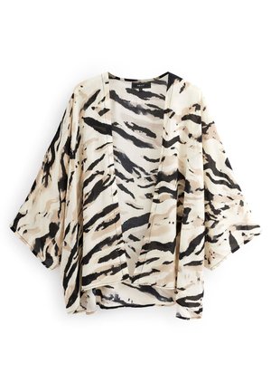Veste kimono ample ouverte devant, manches larges avec imprimé rayures de tigre beige, noir et crème sur tissu léger.