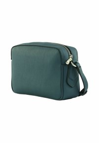 Borsa da toilettatura in pelle verde acqua compatta con cerniera argento e manico laterale, mostrata su uno sfondo bianco.