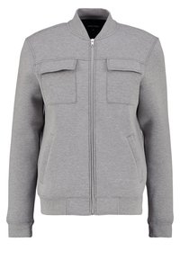 Gray sweatshirt with a zip front, two chest pockets, side pockets, and ribbed cuffs and hem. Made of soft, textured fabric.