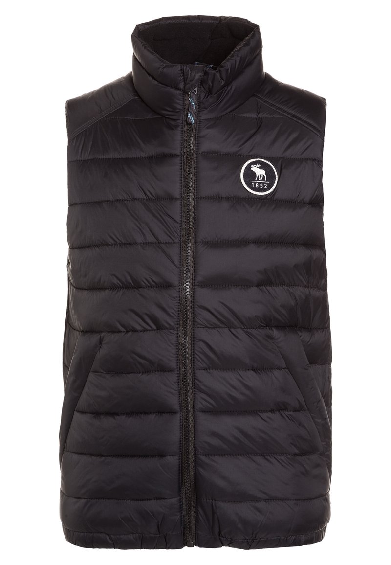 Czarna pikowana kamizelka z wysokim kołnierzem, zapinana na zamek błyskawiczny z przodu, z pionowym wzorem pikowania. Posiada okrągłe logo z łosiem i rokiem 1892.