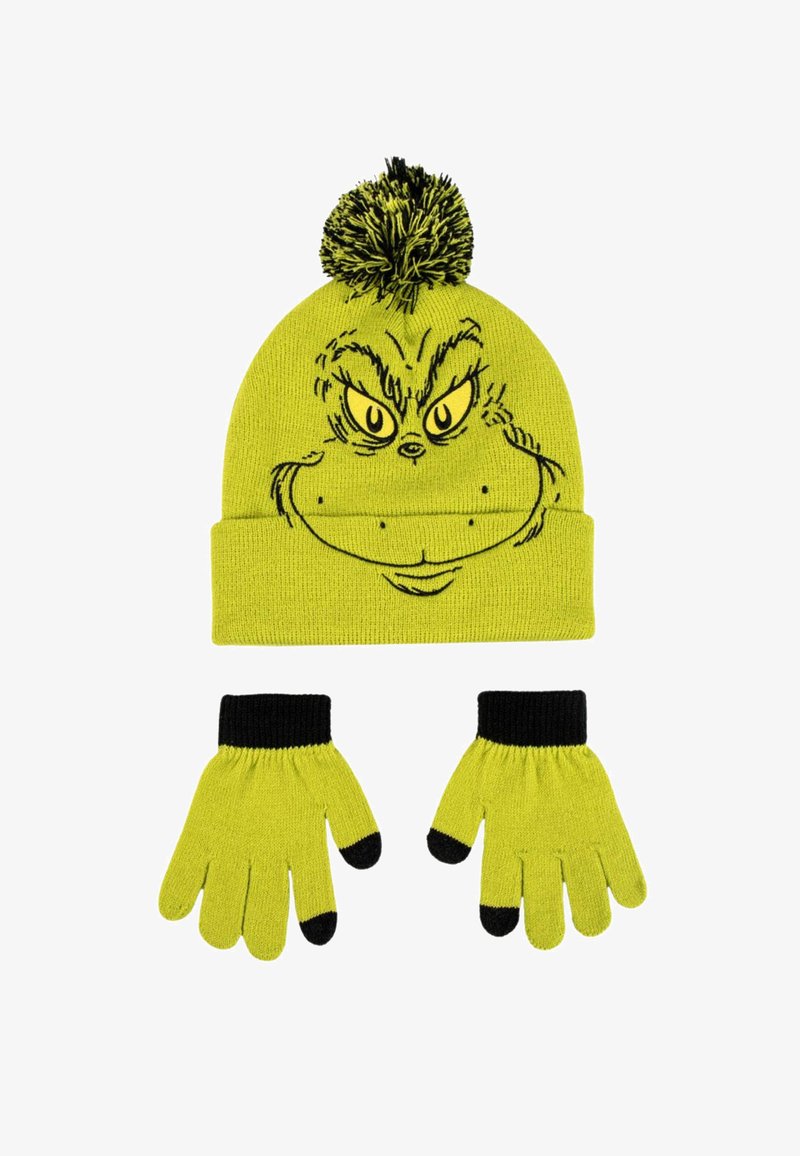 Bonnet en tricot vert avec un pompon noir affichant un visage du Grinch, associé à des gants verts assortis avec des poignets et des bouts de doigts noirs.