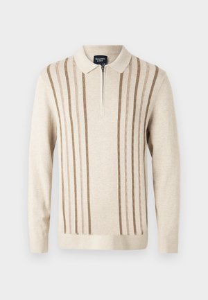 Μπεζ zip-up πλεκτό πουλόβερ με κατακόρυφες καφέ ρίγες, γιακά και μακριά μανίκια. Μαλακή υφή με χαλαρή εφαρμογή.