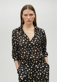 Blusa - black