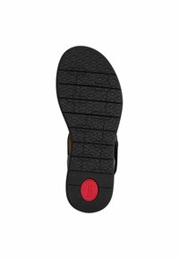 Crna gumena potplat s teksturiranim uzorkom i crvenim kružnim logom koji glasi "Comfort." Ima duboke utore za prianjanje.