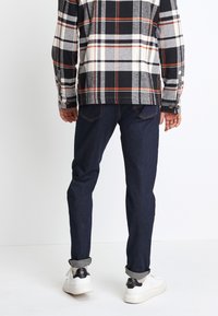 Next Traperice uskog kroja - dark blue denim