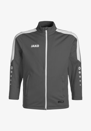 Giacca sportiva grigia con colletto alto, dettagli bianchi, chiusura a zip frontale, tasche laterali e punti decorativi sulle maniche. Presenta un logo del marchio.