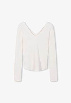 Weißes, geripptes Langarmoberteil mit V-Ausschnitt und figurnaher Silhouette. Es zeichnet sich durch eine weiche Textur und eine verkürzte Länge aus.