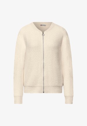 Kermavalkoinen pehmeä vetoketjullinen neuletakki, jossa on resorit hihansuissa ja helmassa sekä pieni pyöreä vetoketjun vetimet.