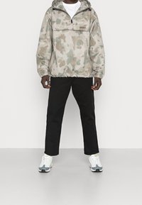 Carhartt WIP Lehká bunda - beige