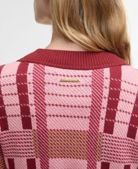 Knit sweater featuring a mix of pink, red, and green patterns; ribbed collar; gold logo tag at back neck; textured fabric.