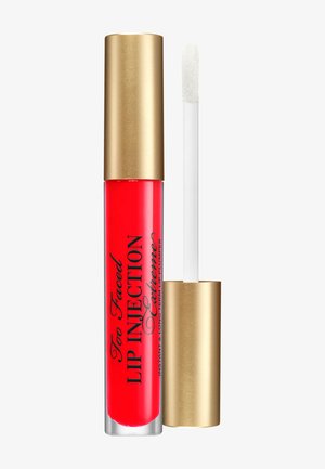 Red lip plumper tube with gold cap and applicator wand, labeled "Too Faced Lip Injection Extreme" on a white background.