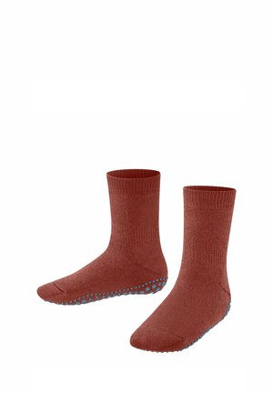 Kupferfarbene Socken mit ribbeliger Struktur und blauen Silikongrip-Punkten an den Sohlen für verbesserten Halt. In der mittleren Wadenlänge.
