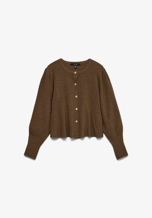 Brūns īss kardigans ar garām pūstām piedurknēm un pieciem maziem apaļiem pogām priekšpusē, izgatavots no adīta auduma.